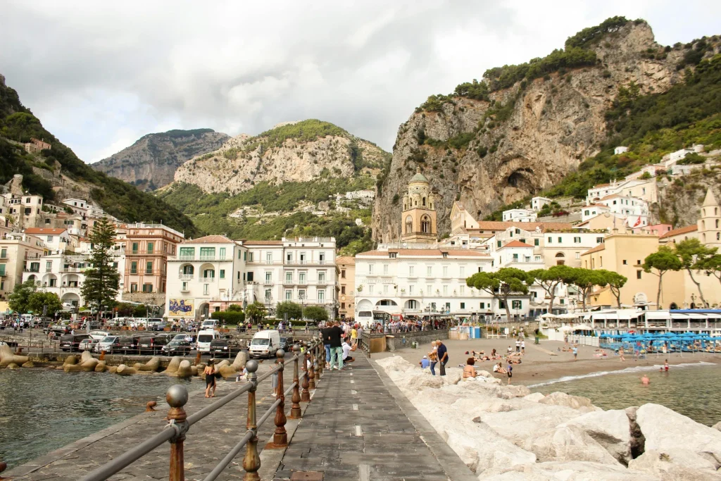 The seafront of Amalfi with the Duomo di Sant’Andrea and the mountains behind