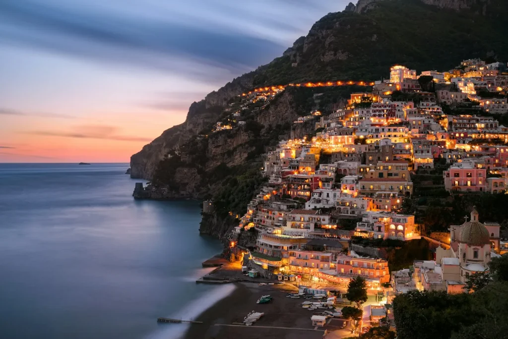 Positano seen from the sea at blue hour, Amalfi Coast