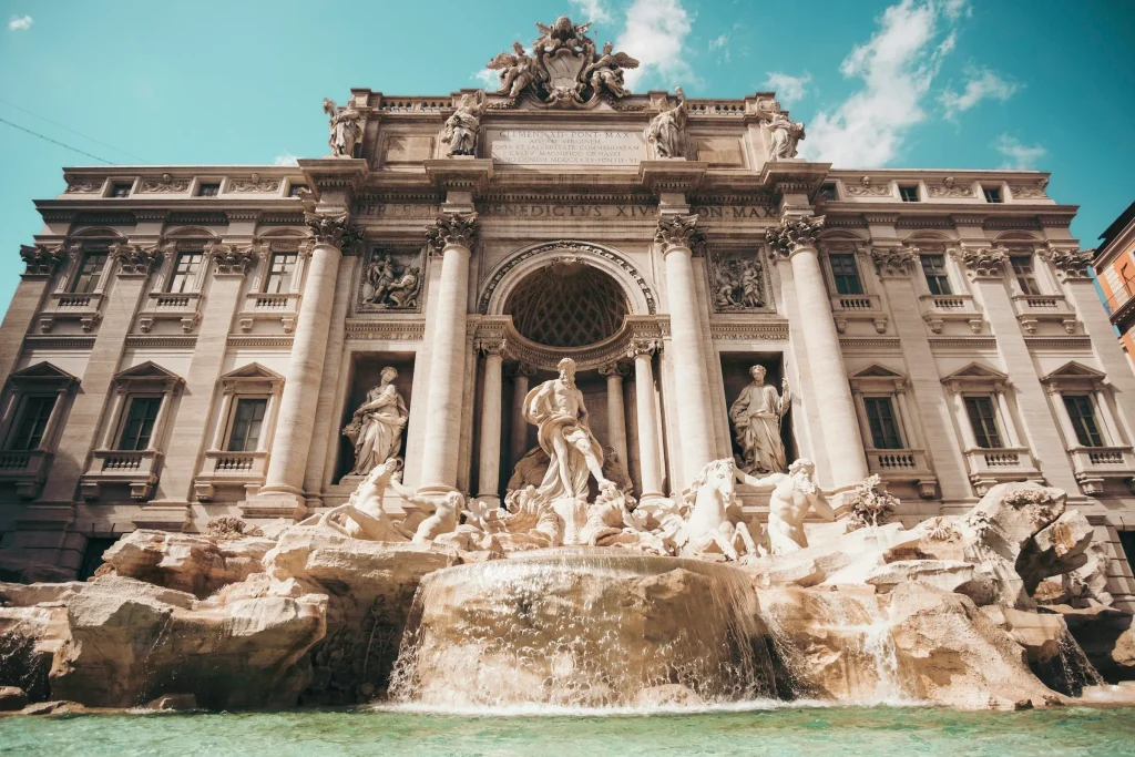 The Trevi Fountain in Rome with its carved stone figures and running water
