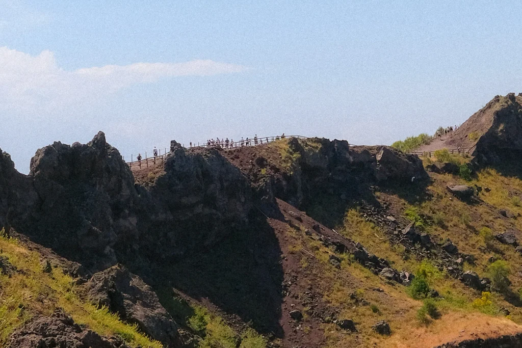 Walkers on the rim path around the crater of Mount Vesuvius